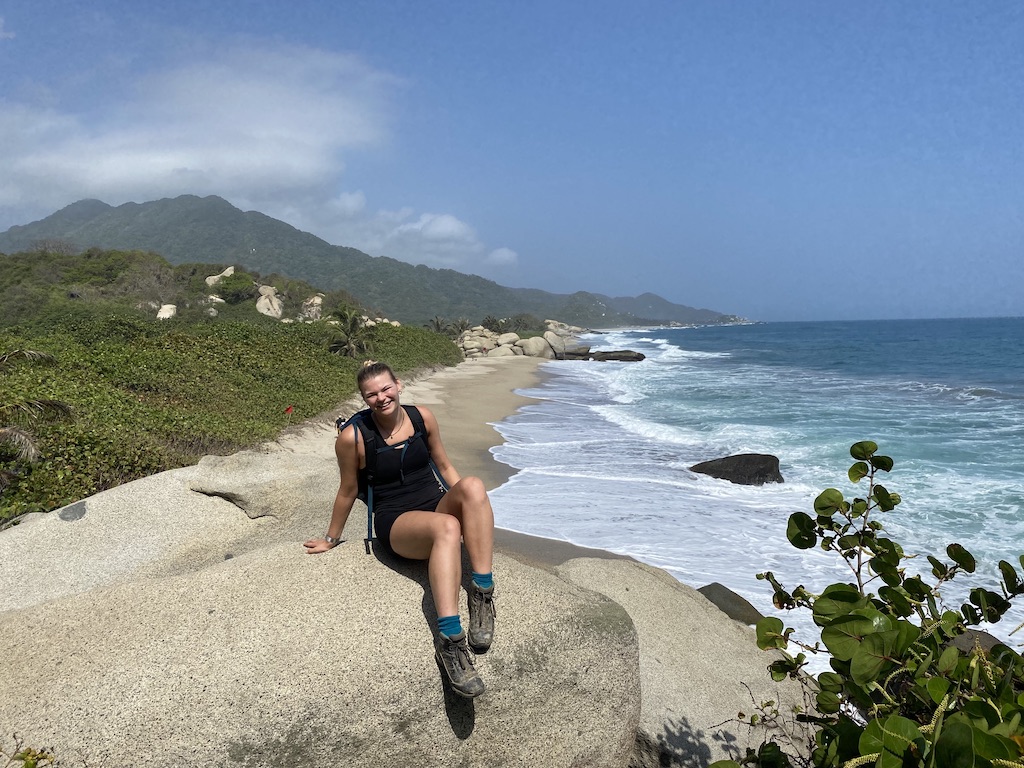 My sister, Lou, sat at a viewpoint overlooking Cañaveral, the easternmost accessible beach in Tayrona National Park