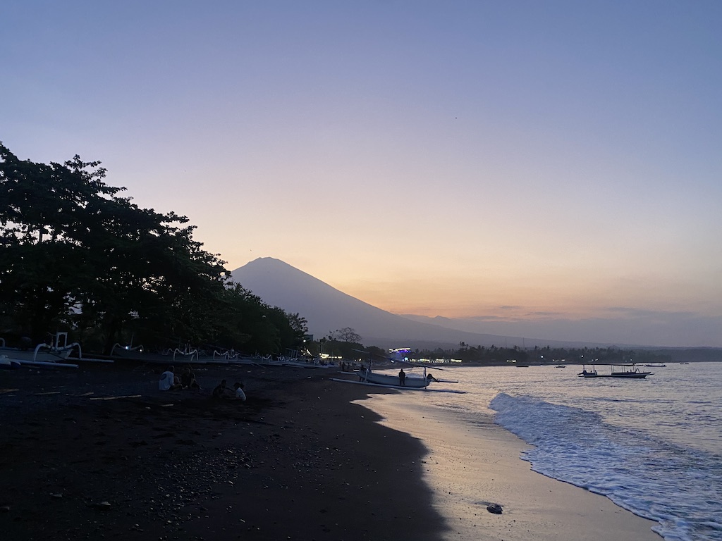 The sun setting behind Mt Agung at Amed beach